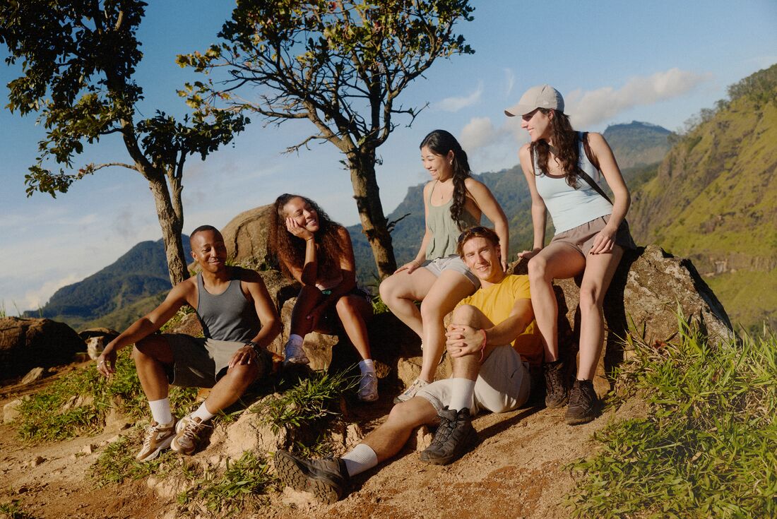 Group of Intrepid Travellers taking a break while hiking on the Pekoe Trail in Sri Lanka