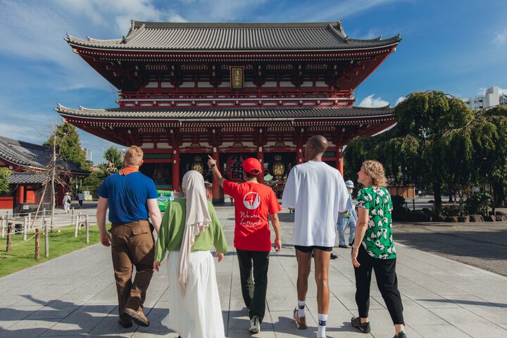 A group of travellers walking up to the Sensoji Temple in Tokyo, Japan. 