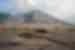 An ultra-wide shot of Mt Yasur Volcano with smoke billowing from the top