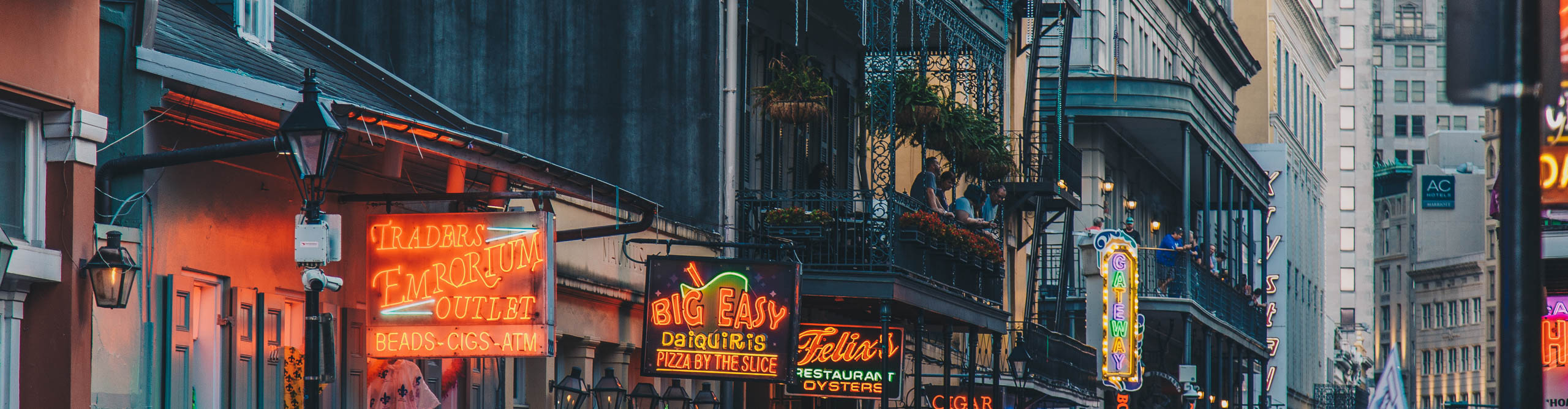 Signage and french housing on Bourbon Street in New Orleans