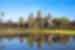 TKPC - View of Angkor Wat across lake on a sunny day