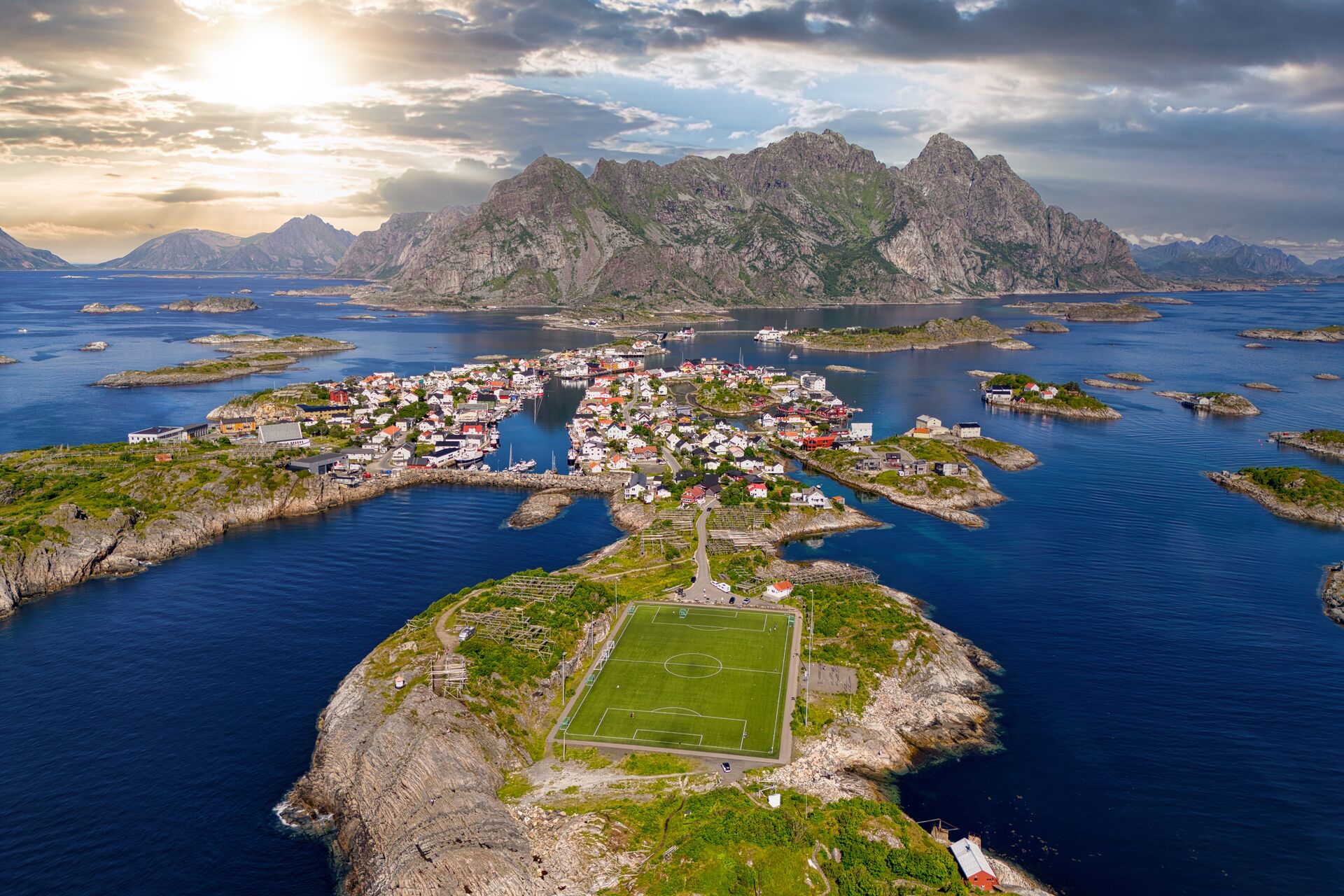 Henningsvær village and its famous soccer pitch nestled among a stone outcrop