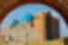 The cerulean domes of Khoja Ahmed Yasawi Mausoleum visible through a sandstone arch, Turkistan, Khazakhstan