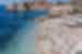 Blue waters and terracotta roofs by the coastline of Dubrovnik