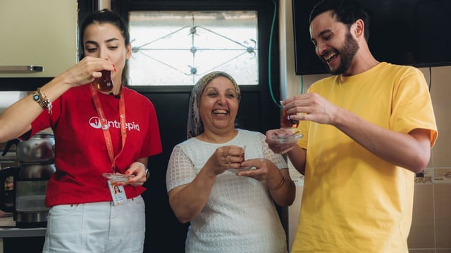 Travellers sip on tea with Nuray, their Cappadocia homestay host.