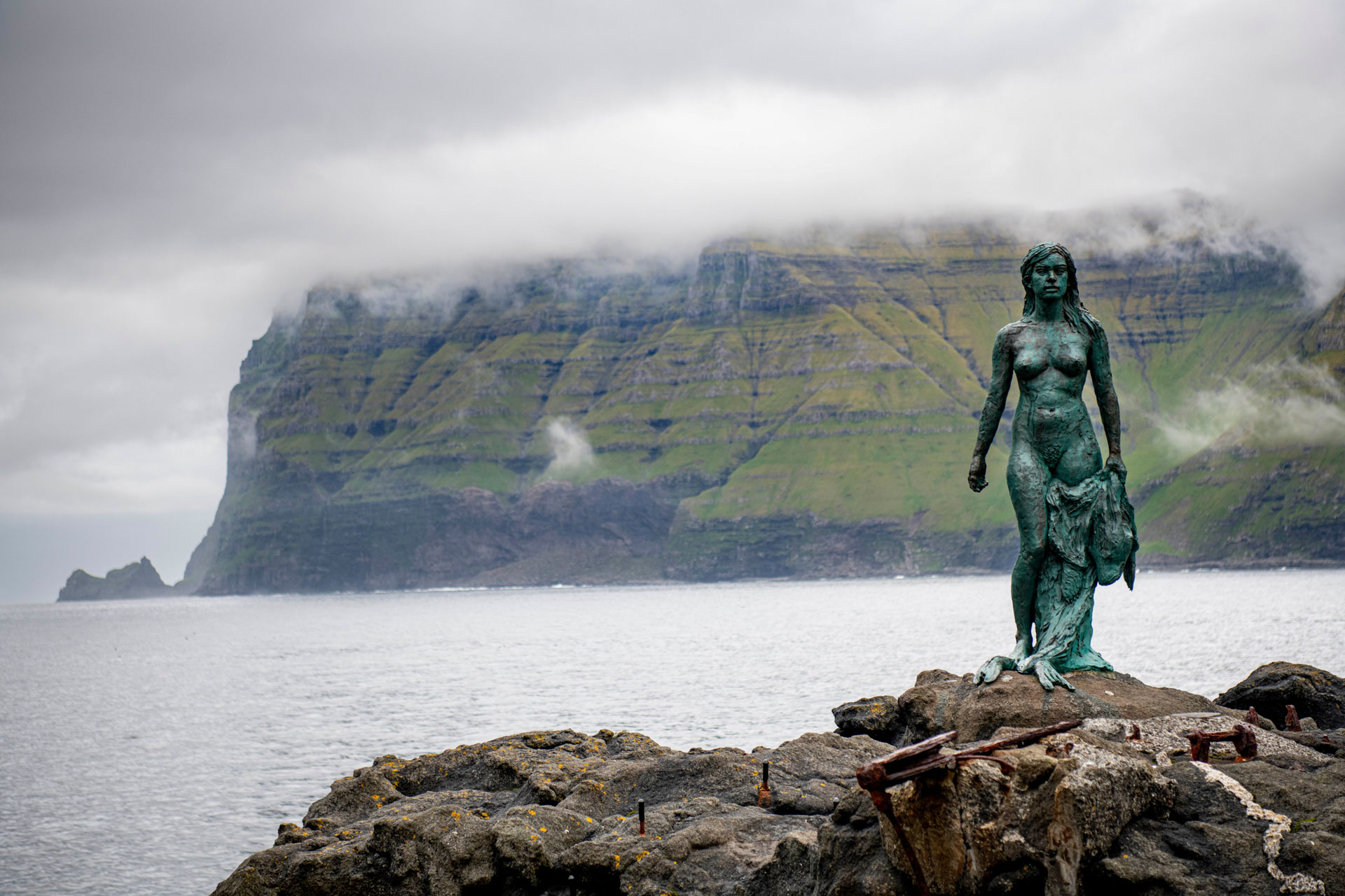 A statue of the Kópakonan, seal woman, at Mikladalur on Kalsoy Island