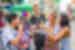 Group of friendly 18 to 35 travellers gather to try some street food balls in Bangkok