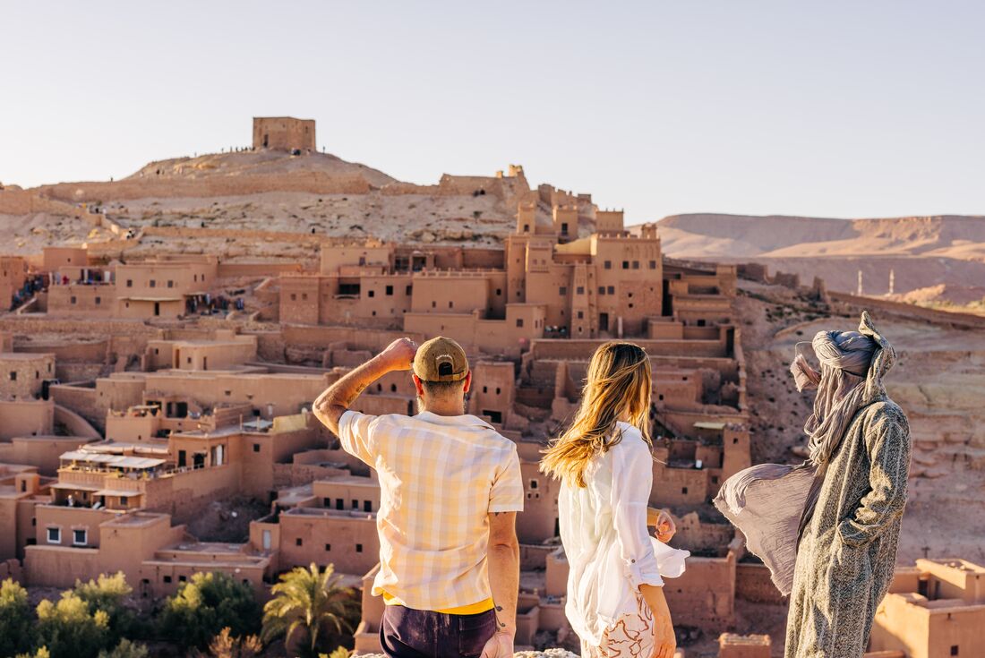 Travellers with guide at Air Benhaddou village, Morocco