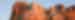 The four faces of Mount Rushmore at sunset, glowing orangey pink, South Dakota, USA