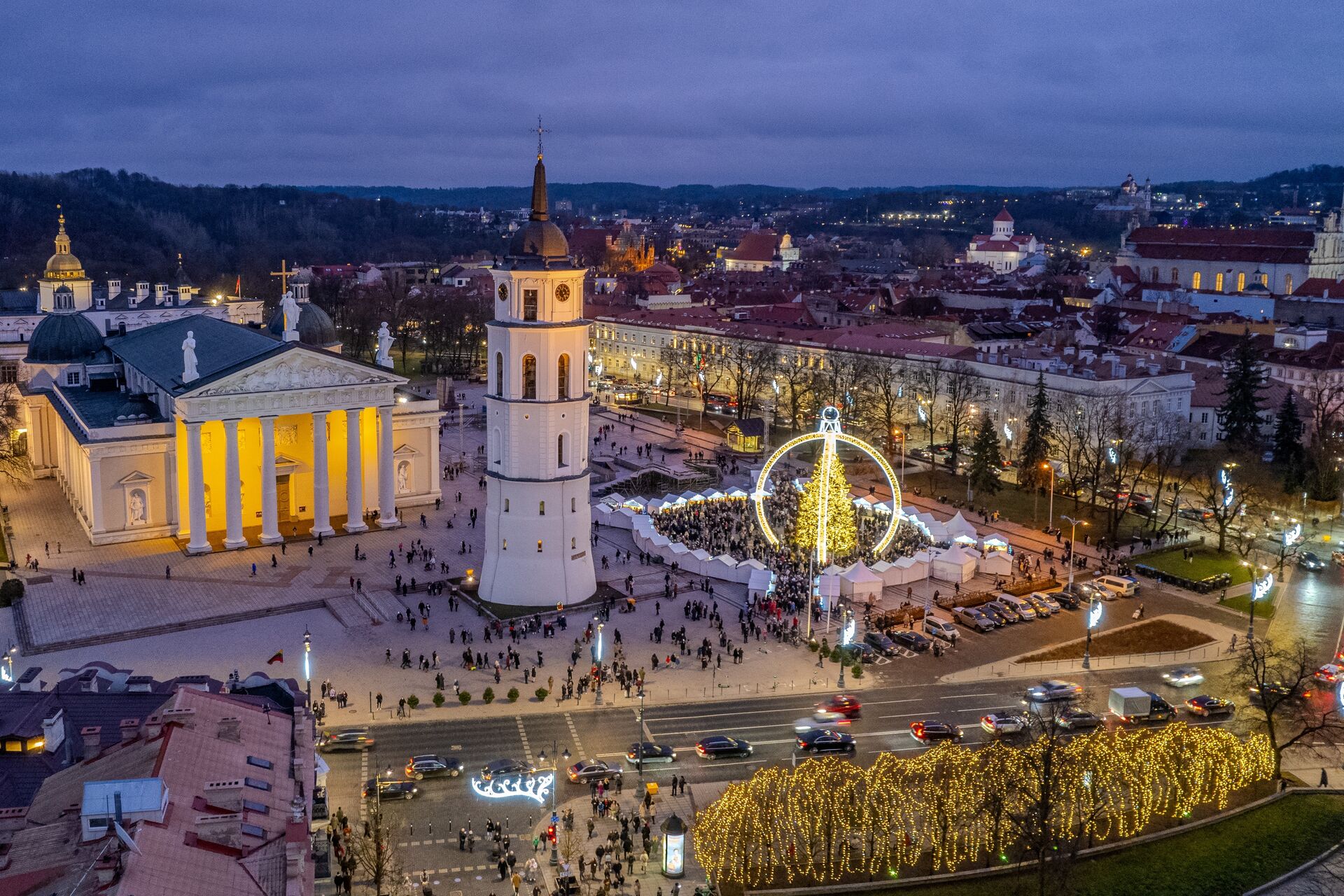 Cathedral Square Christmas Markets in Vilnius abound with light, stalls, and happy locals