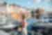 Traveller standing in front of boats and harbour at Honfleur, France