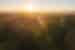 Sunrise over the Transilvanica Trail forest in Romania