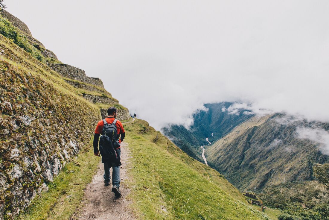 Traveller hiking on path on Inca Trail in Peru