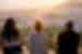 Group of travellers watching the sunset over colourful buildings in Chefchaouen, Morocco