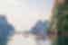 Travellers paddle on kayaks on halong bay