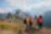 Intrepid travellers talk and laught together at the Machu Picchu lookout in Peru