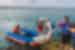 Tour leader helps traveller off panga boat, Galapagos Islands