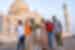 Travellers laugh together in a group photo at the Taj Mahal near Agra in Rajasthan India