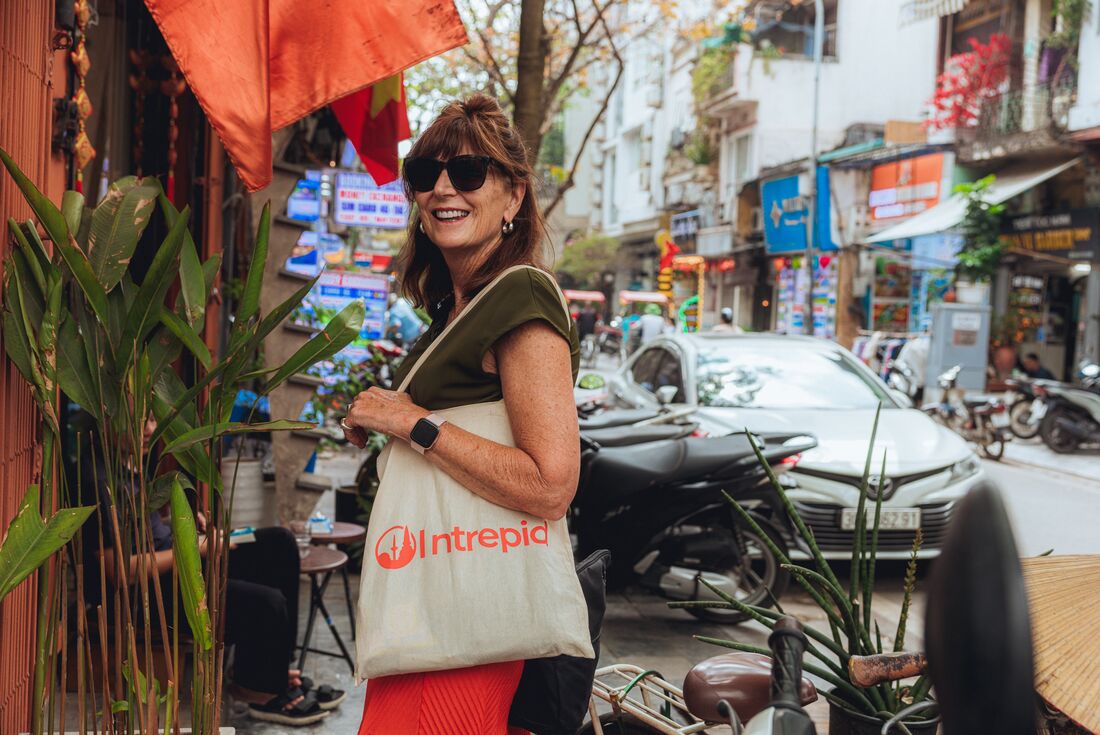 Traveller smiles at camera while on a walk in Hanoi