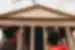 Two travellers looking up at the inscription on the front of the Pantheon, Rome, Italy
