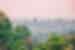 Angkor Wat seen from a distance in the mist in Cambodia