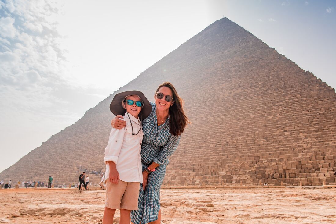 At the base of the Great Pyramids of Giza outside Cairo