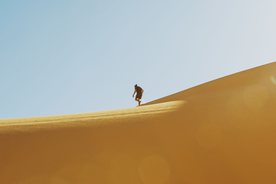 Cresting a sand dune in the desert of Wadi el Rayan