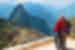 Traveller couple standing with view of Machu Picchu, Peru