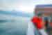 Intrepid traveller looks out from boat ride across Lake Lucerne in autumn
