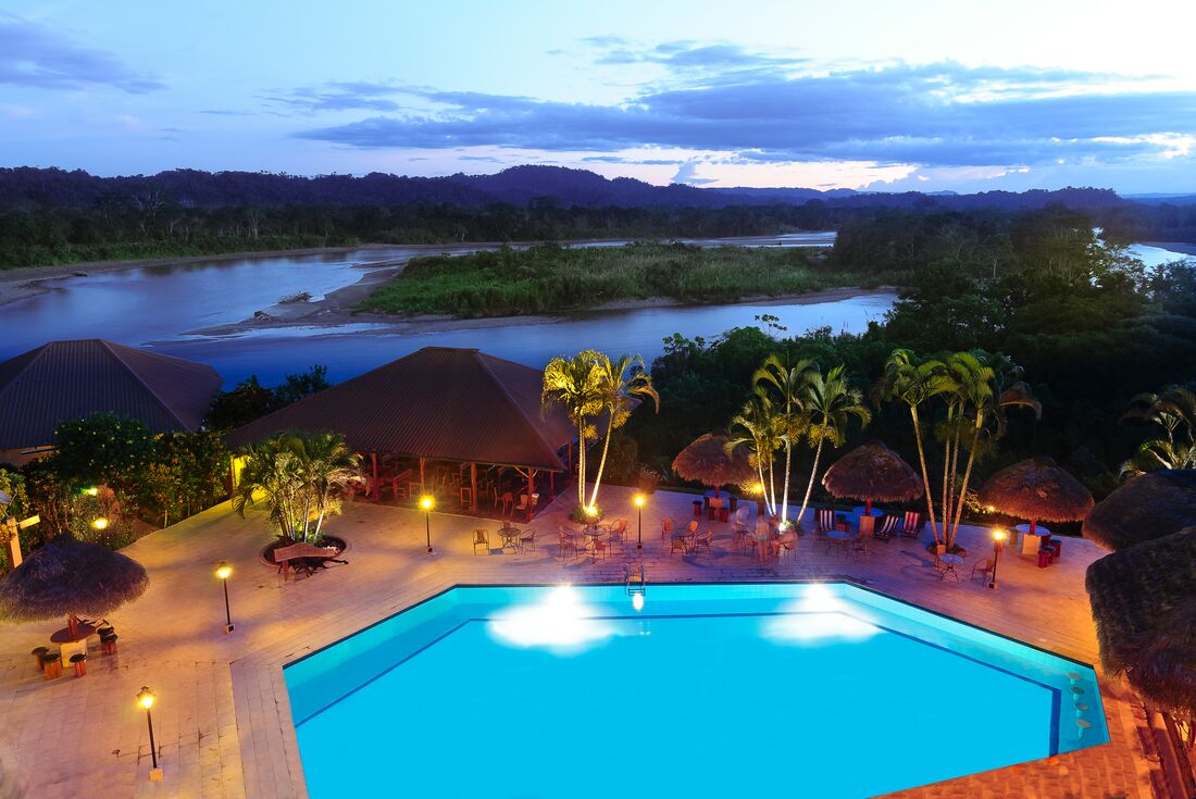 Take in the sunset on the Amazon rainforest at La Casa del Suizo