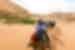 Travellers ride camels through Sahara Desert, Morocco