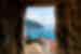 View out a narrow ancient window from oldtown over Dubrovnik and the coast of Croatia beyond