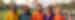 A group of people in traditional Indian coloured clothing at the Taj Mahal