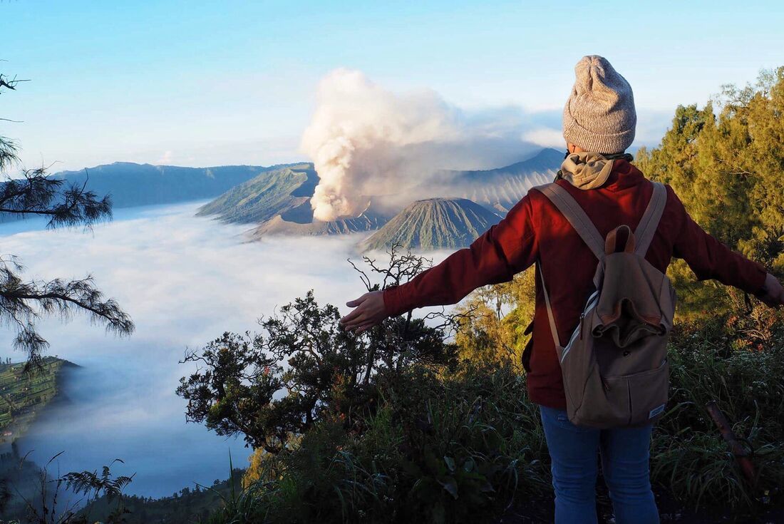Traveller at a lookout point while hiking at Mount Bromo, Indonesia