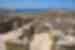 Walking throught the stone walled footprints of Greek ruins of Delos island in the Cyclades