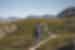 Male traveller hikes toward plateau mountain tops in western Greenland toward Lingmark Glacier