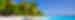Tropical beach with white sand, blue water and palm trees in Fiji