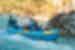 Family with teenagers whitewater rafting in Soca Valley River in Slovenia