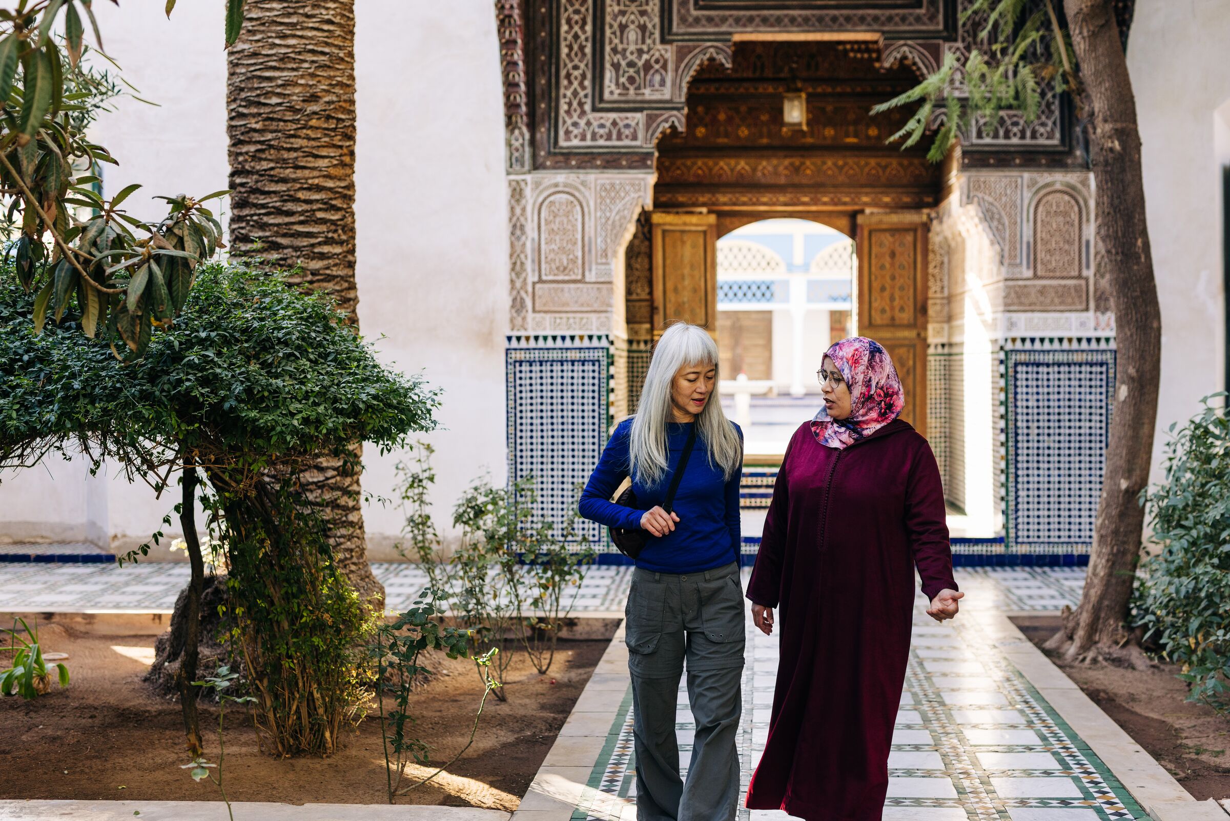 Travellers chatting while exploring Marrakesh, Morocco