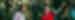 An Intrepid leader in red t-shirt gestures and smiles with a traveller in front of banana trees