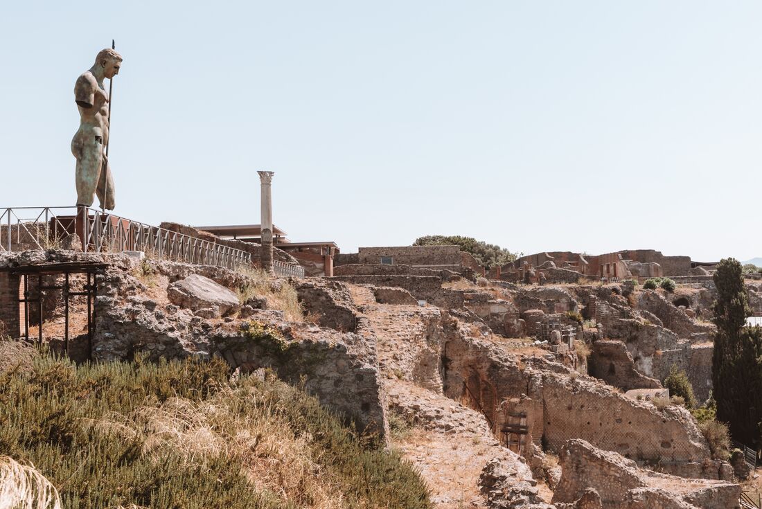 Daedalus looking out over the ruins of Pompeii in the shadow of Mount Vesuvius