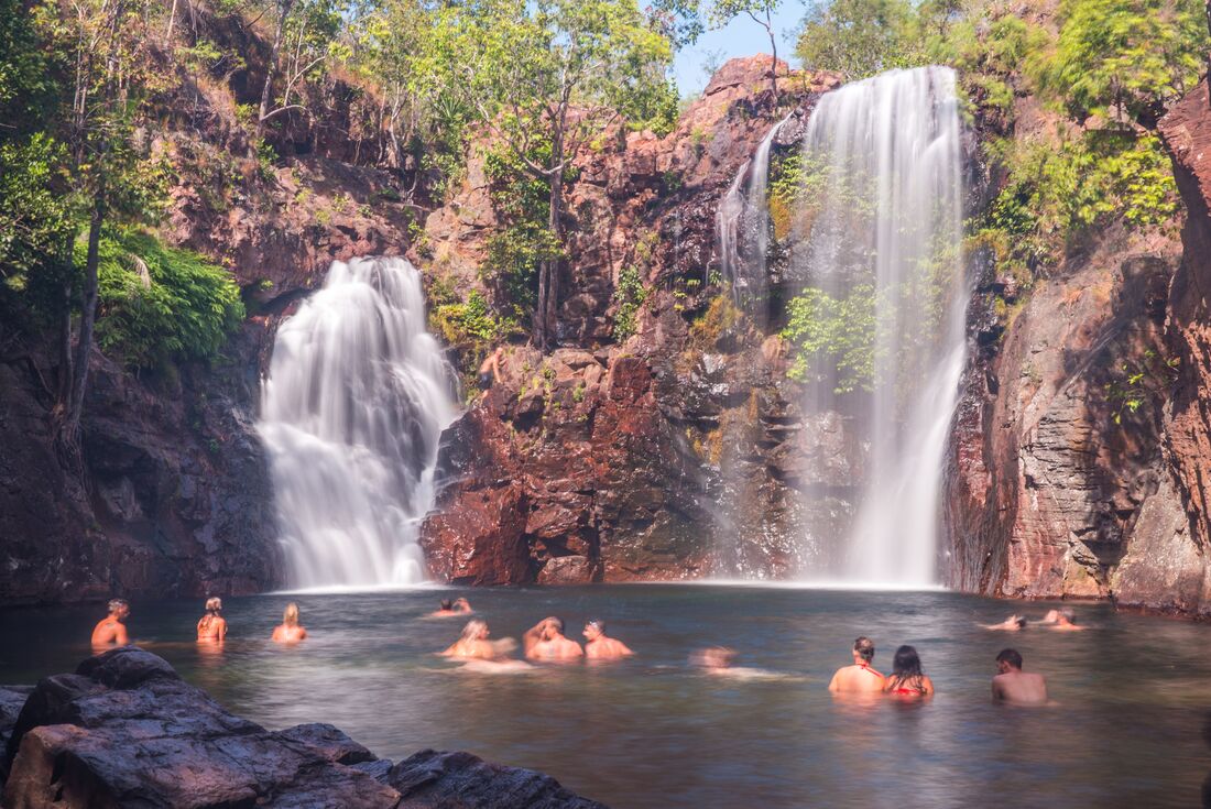 Travellers swimming in Florence Falls - Litchfield National Park - Northern Territory