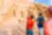 Traveller points out details on the front of Abu Simbel temples in Egypt