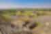 Looking out over spread of ancient city of Teotihuacan in Mexico from top of stone ziggurat