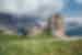Intrepid traveller crests a hill trekking Cinque Torri near Cortina d'Ampezzo in Italy's Dolomite mountains