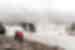 Travellers and leader look upon the Goðafoss waterfall