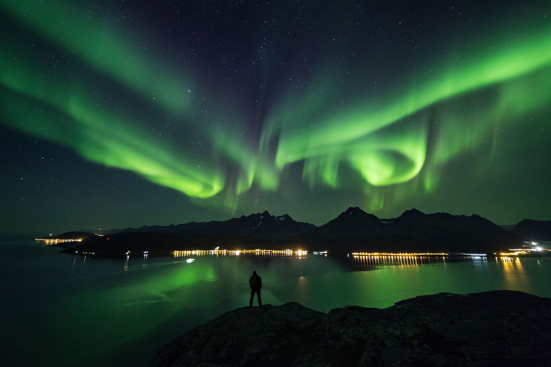 Take in the Northern Lights over the Lyngen Alps and fjord
