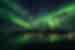 Take in the Northern Lights over the Lyngen Alps and fjord