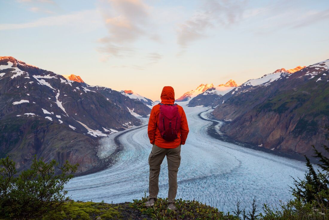 Intrepid Traveller takes in the view during sunset at Salmon Glacier in British Columbia, Canada