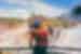 Intrepid traveller 18 to 35 marvelling at the surroundings of Iguazu falls as a rainbow arches in front